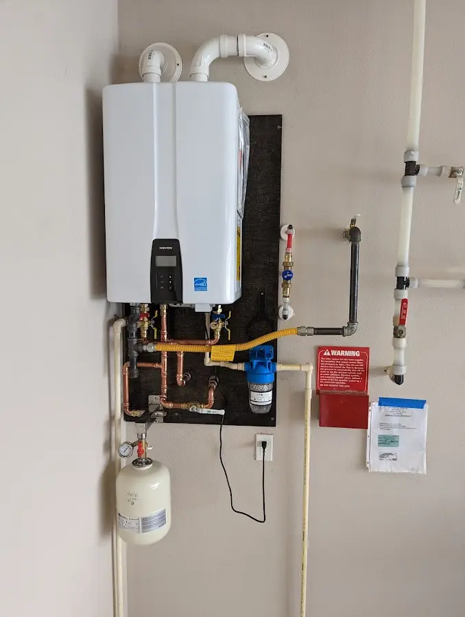 Professional plumber installing copper piping in a Cordes Lakes home